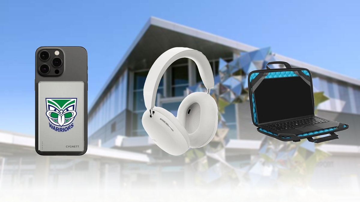 Warriors power bank attached to a smartphone, white headphones and a laptop in a carry case, with Christchurch Airport’s silver sculpture blurred behind - Travel Accessories at Tech Supply Shed NZ
