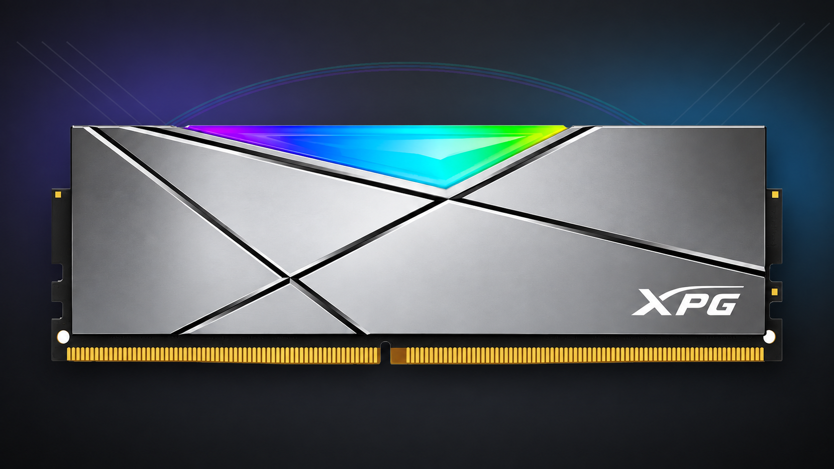 XPG RGB desktop RAM module with silver geometric heat spreader and multicolour RGB lighting on a dark gaming-themed background.