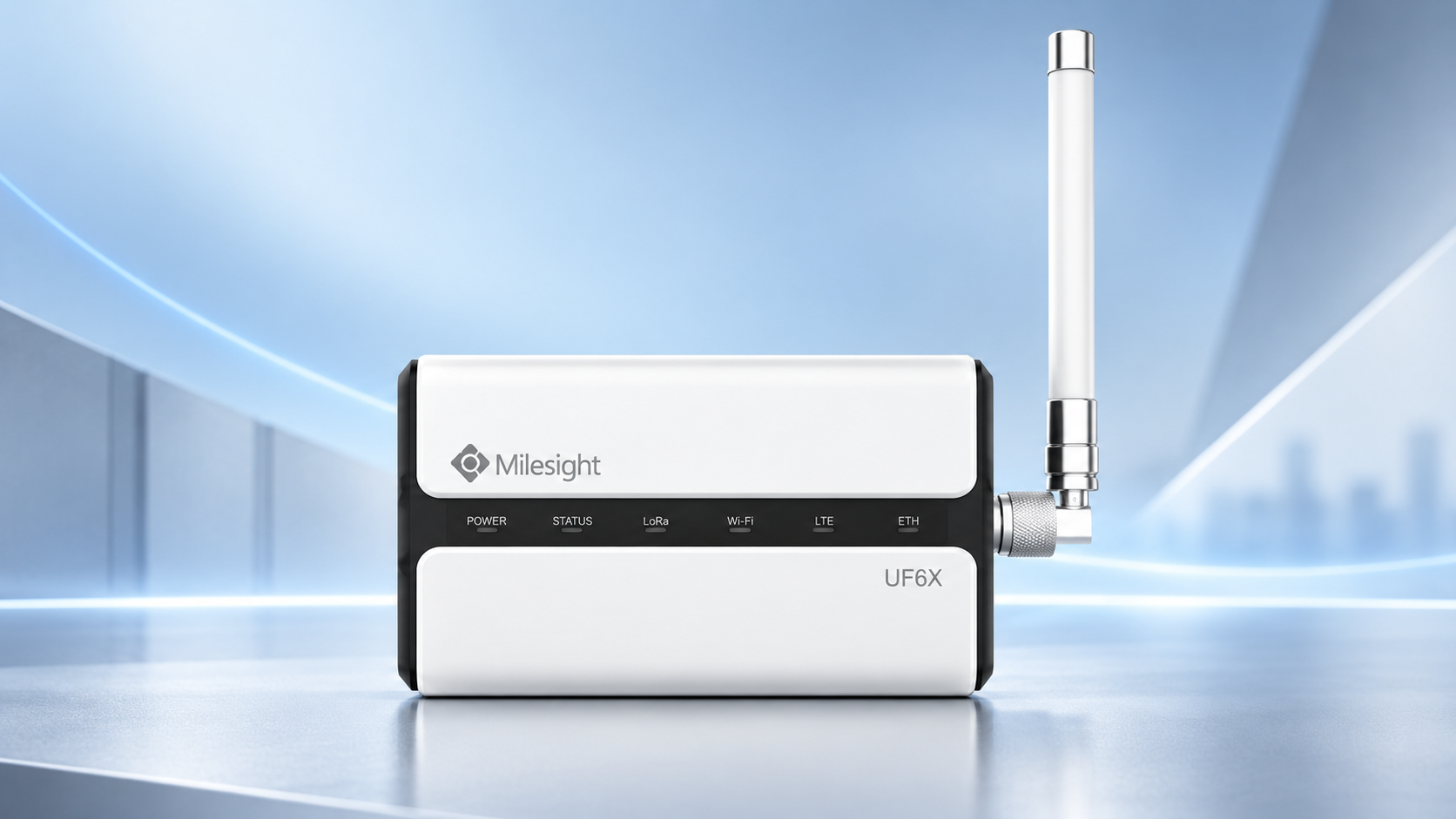 Milesight UF6X industrial IoT gateway with external antenna on a modern technology background.