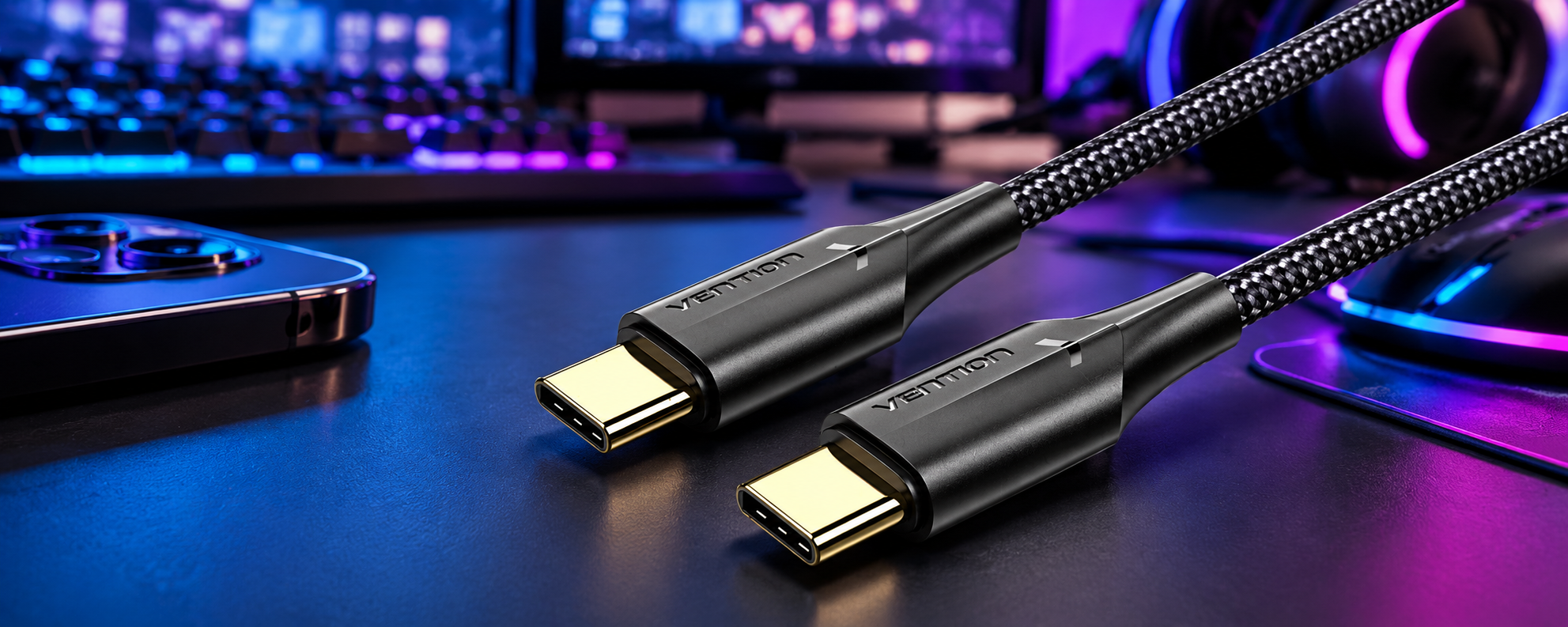 Vention braided USB-C cable with gold connectors on a gaming desk background with RGB lighting.