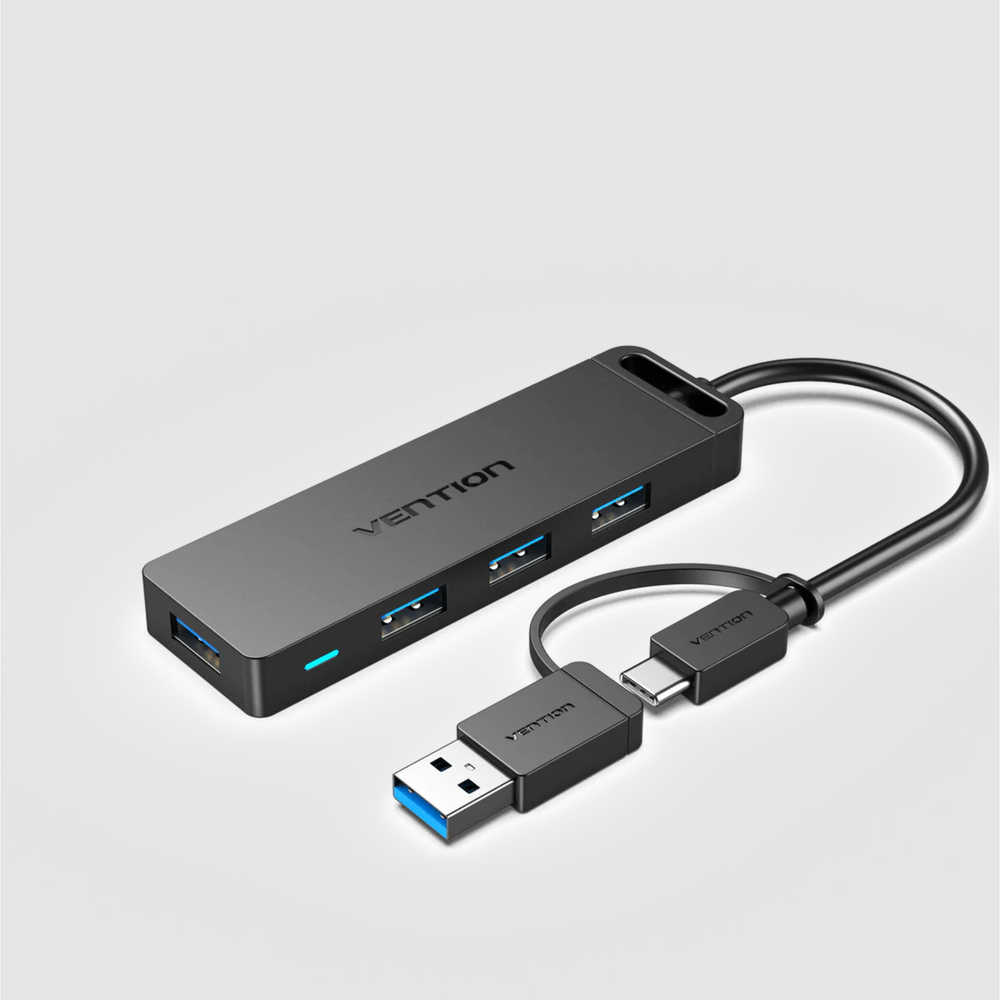 Black 4-port USB 3.0 hub with USB-C and USB-A ports, power cable and connectors