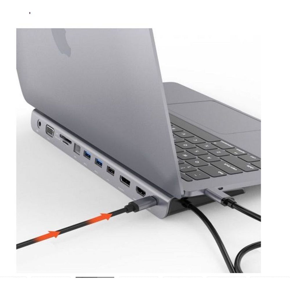 Gray USB-C multiport dock ports beside a laptop keyboard with cables
