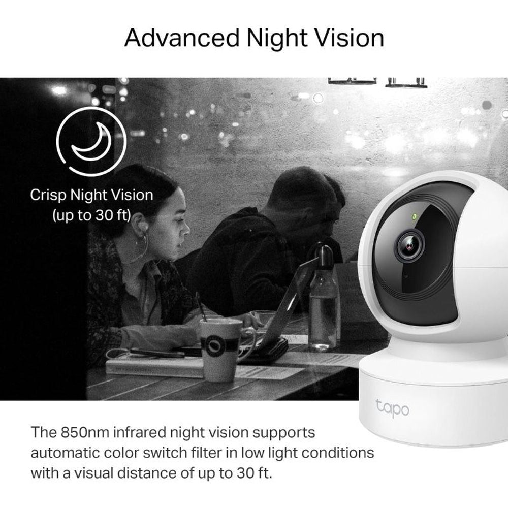 White indoor pan-tilt security camera with black lens for low-light monitoring