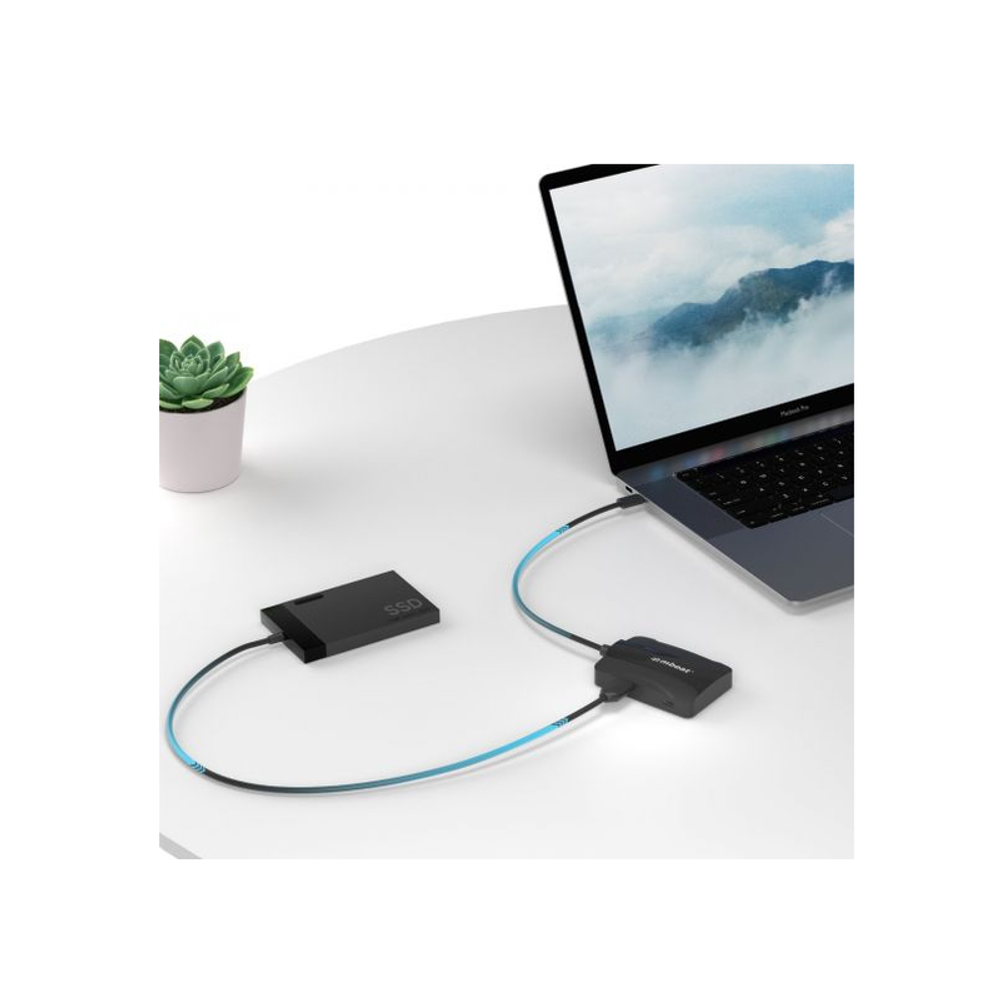 Mbeat USB-C hub with cables plugged into a laptop