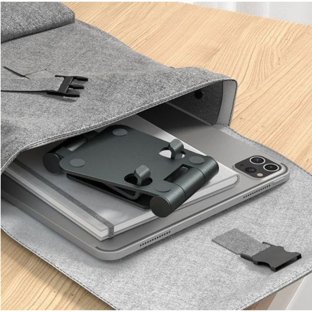 Foldable stand storage view showing grey cradle insert inside cover
