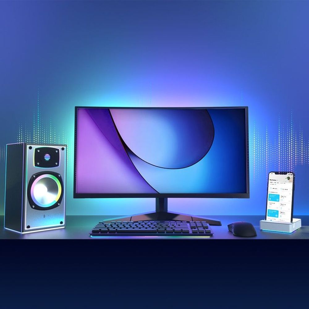 Smart Wi-Fi light strip lighting behind a desktop monitor