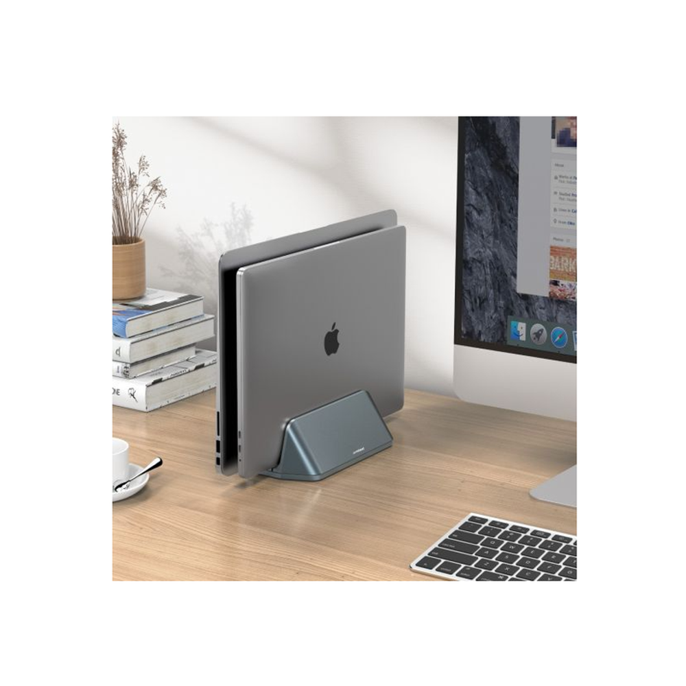 Space gray vertical stand supporting a laptop/MacBook on an angled cradle