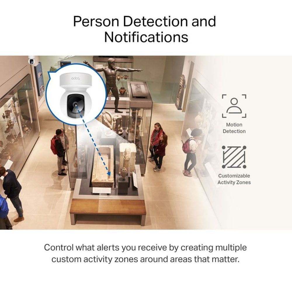Front view of white indoor pan-tilt security camera with black lens on base