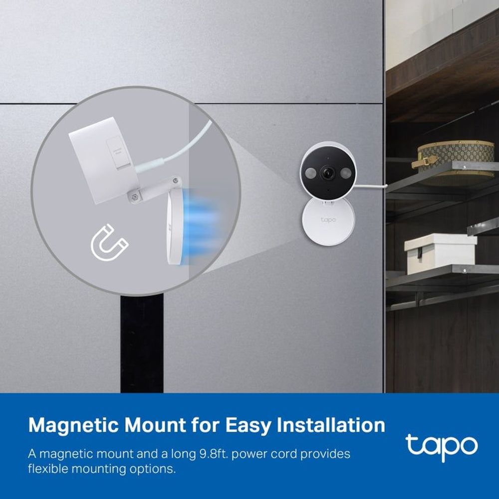 Magnetic-mount white Wi‑Fi security camera on a wall with visible power cord
