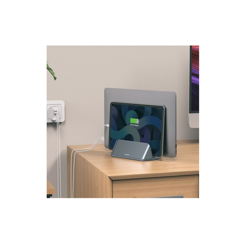 Space gray vertical tablet stand with angled cradle on a desk