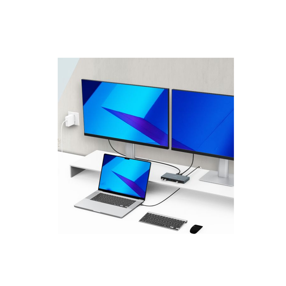 Space grey USB-C dock at desk connecting dual monitors and a laptop