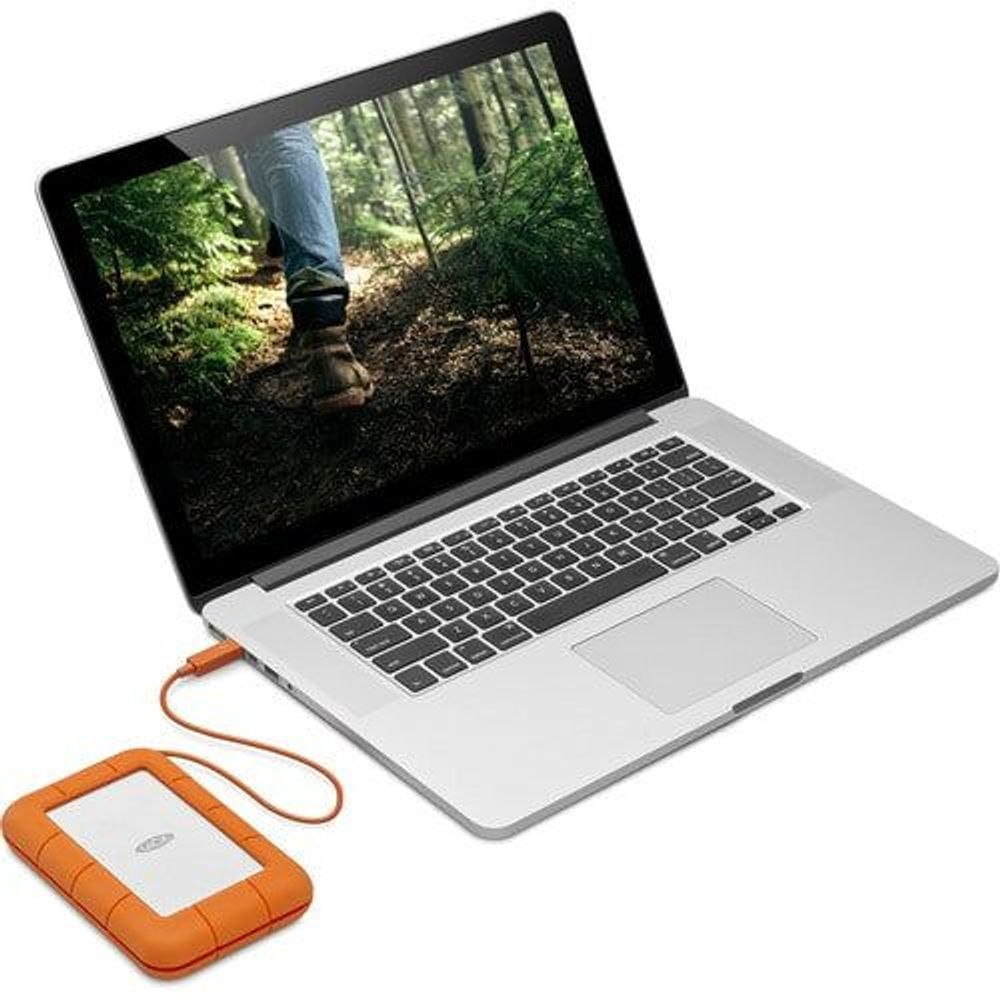 Orange rugged portable external hard drive with lanyard and orange cable connected to laptop