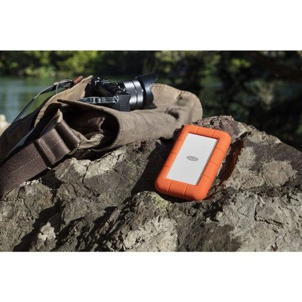Orange rugged portable external hard drive with secure case, rectangular front, on rocks