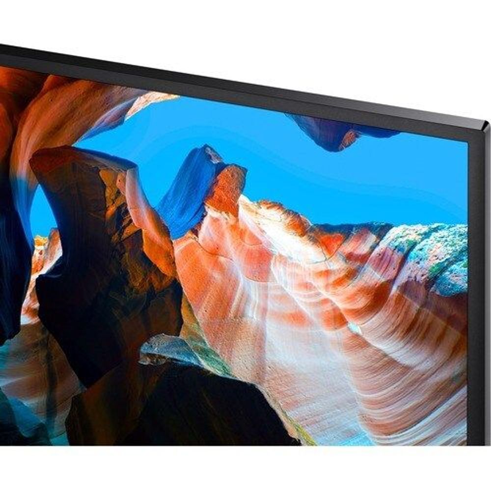 Samsung LCD monitor close-up of the screen in dark frame on a stand