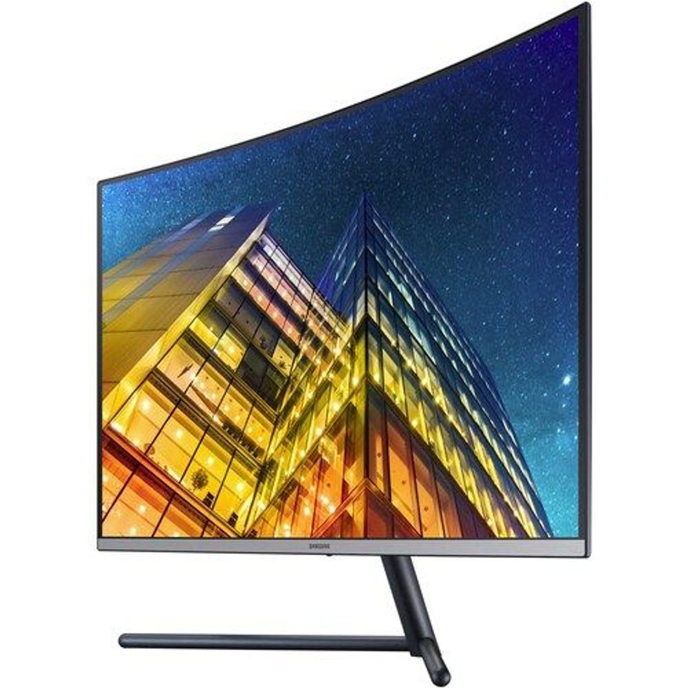 Samsung curved UHD LED monitor front view with cityscape artwork and black stand