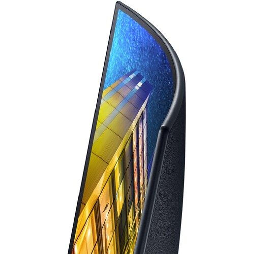 Samsung curved UHD LED monitor angled close-up showing thin dark bezel and stand