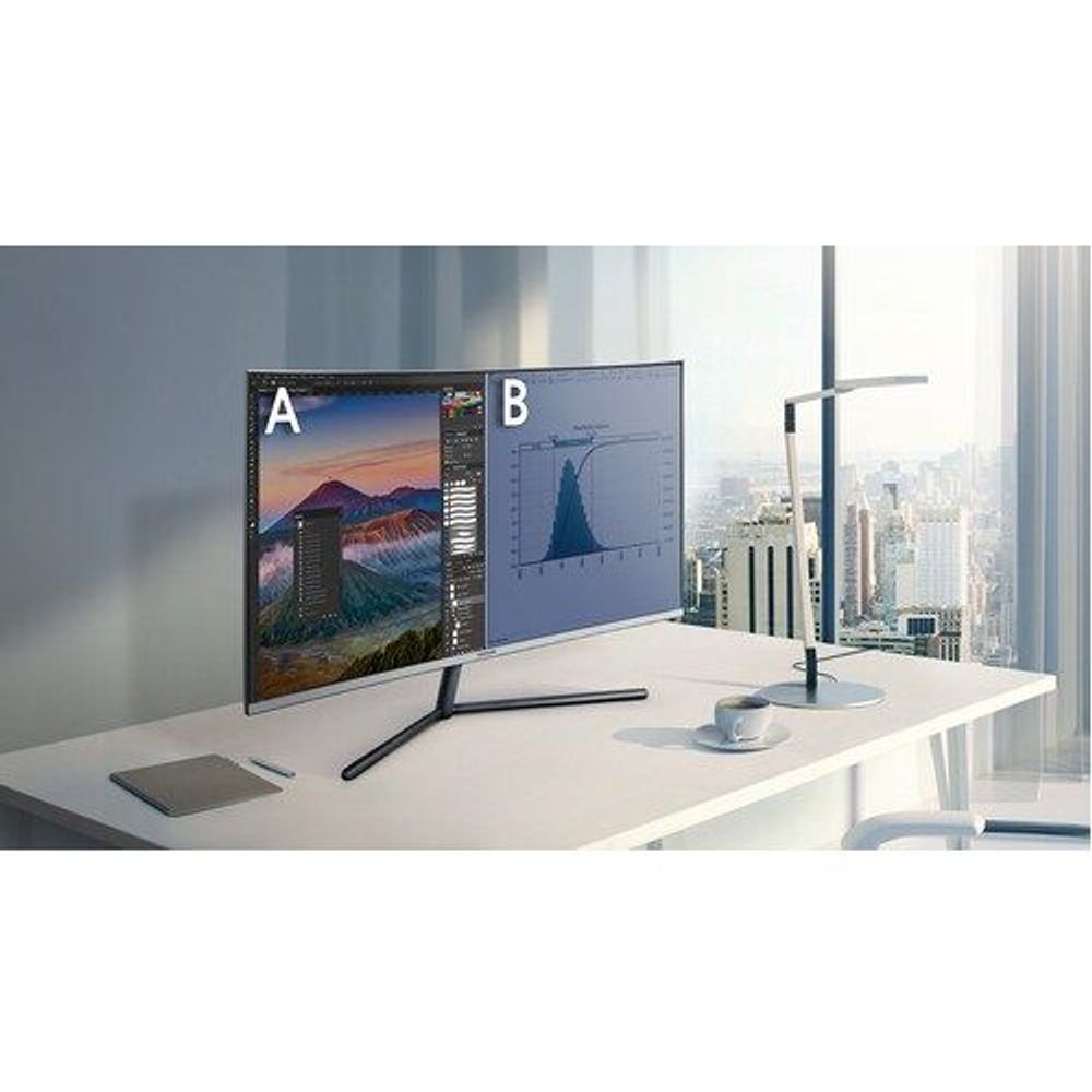 Samsung curved UHD LED monitor on desk with slim black stand