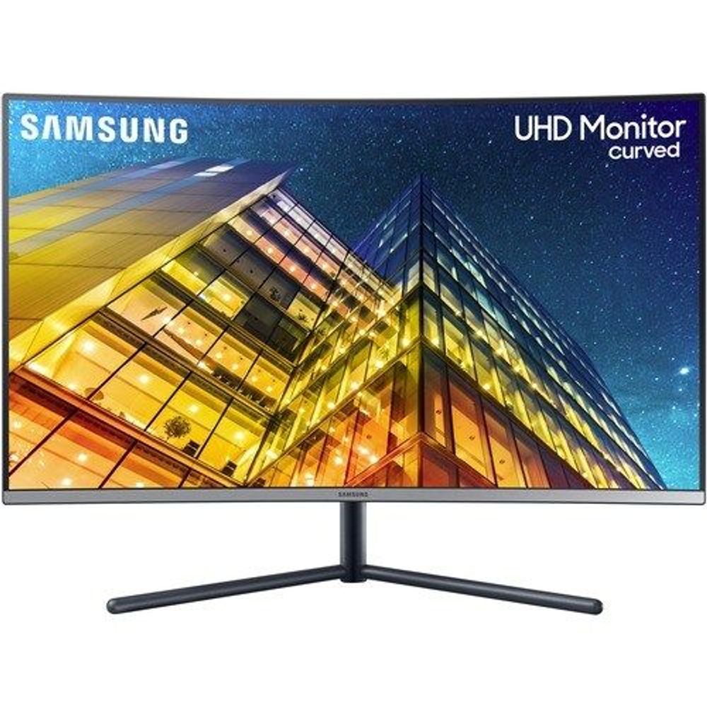 Samsung curved UHD LED monitor with black stand showing cityscape wallpaper