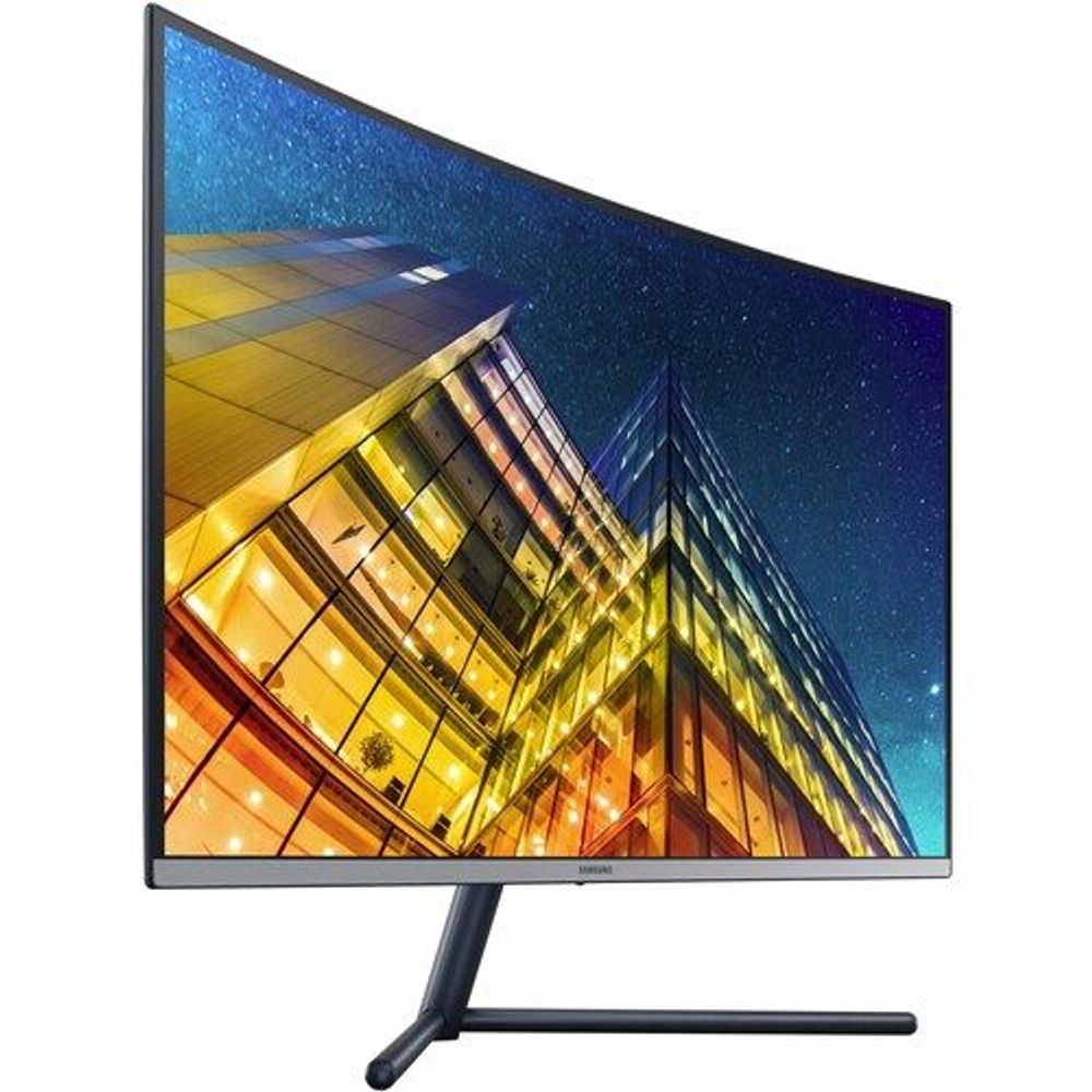Samsung curved UHD LED monitor angled view, showing colorful city scene on screen