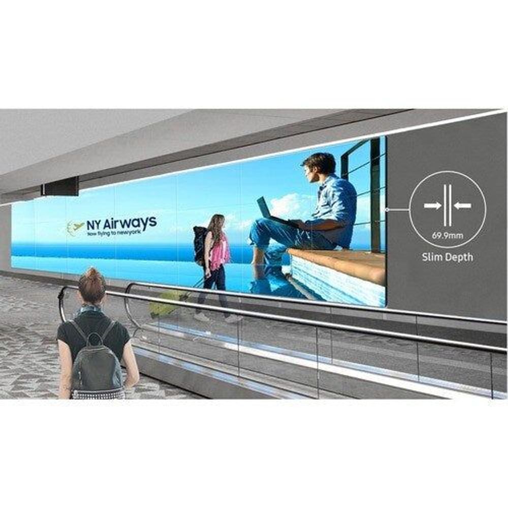 Digital signage display in transit setting, showing travel video and slim depth graphic