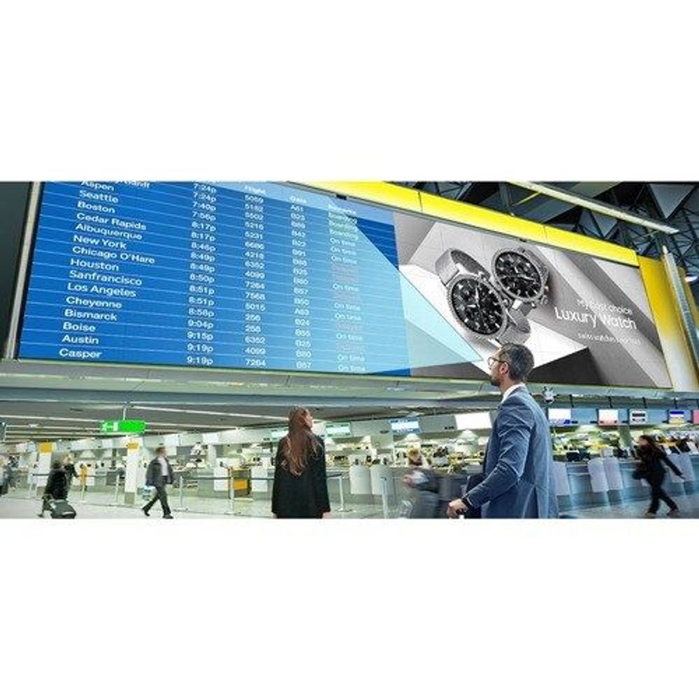 Samsung 55-inch digital signage display in a retail setting with city schedule list