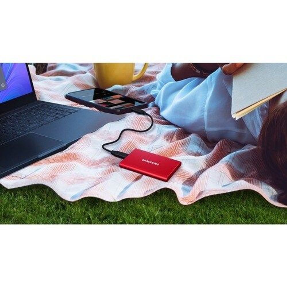 Red Samsung Portable SSD T7 external drive with connected cables