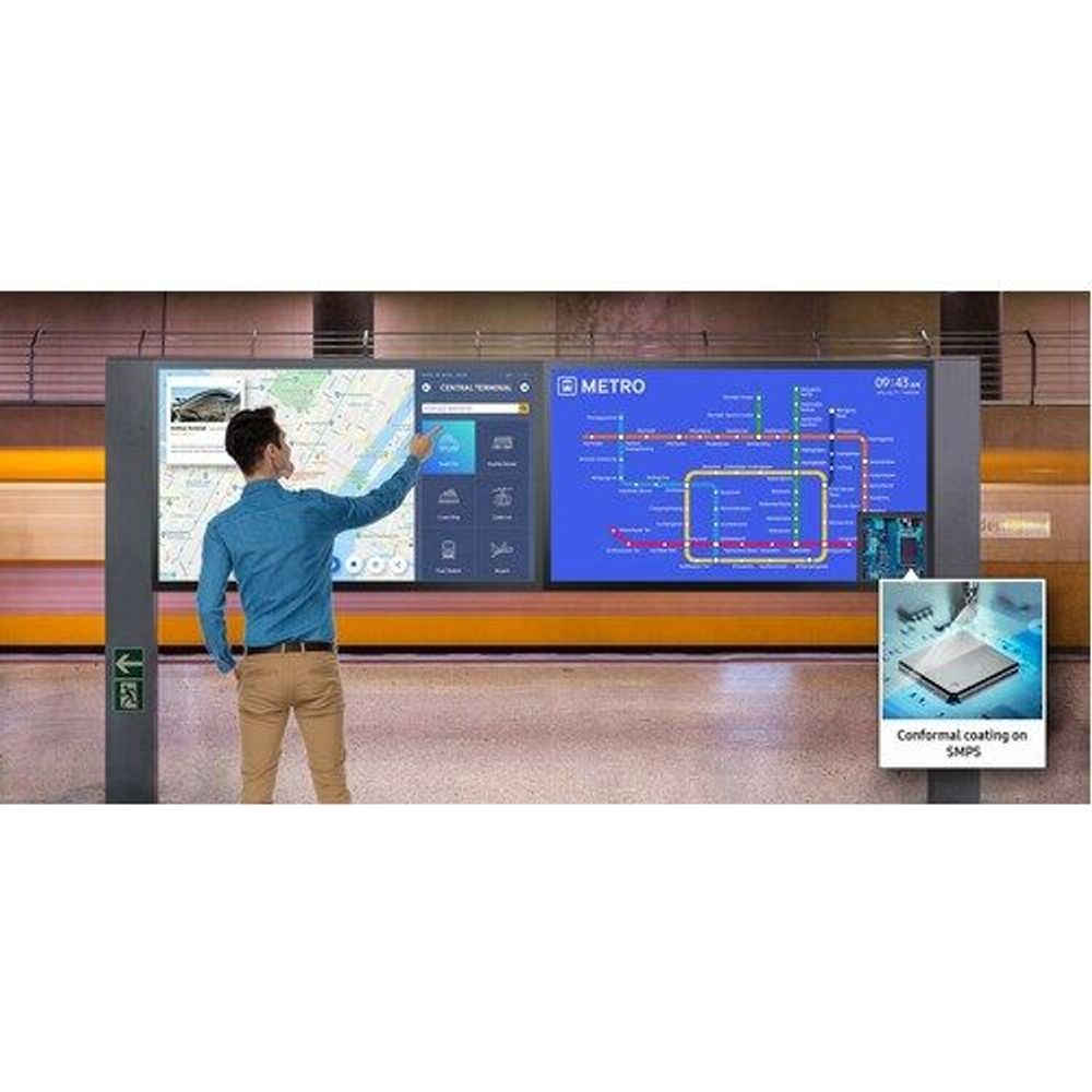 Touchscreen digital signage display mounted in public venue, presenting interface screens
