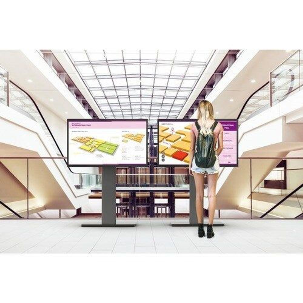 32-inch touchscreen digital signage display with wayfinding graphics in a mall corridor