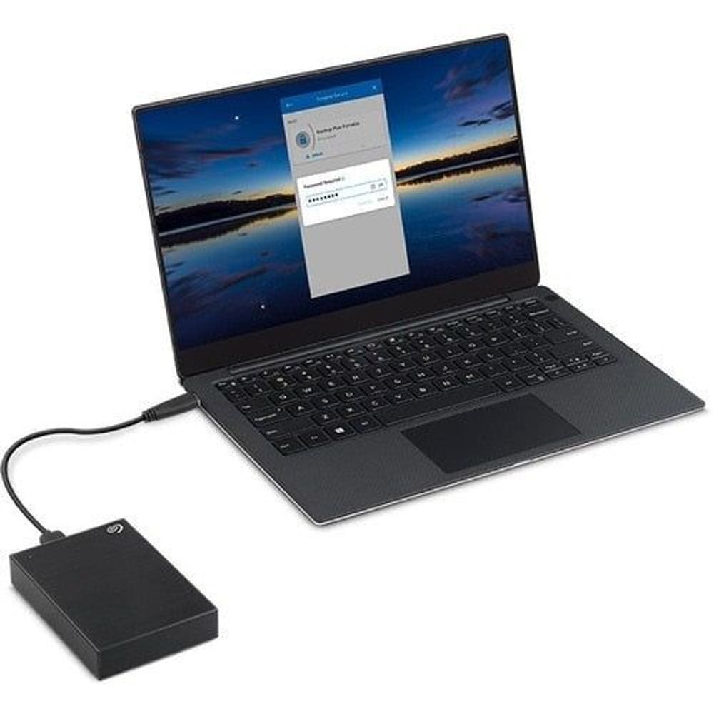 Black Seagate One Touch portable hard drive connected to a laptop via USB