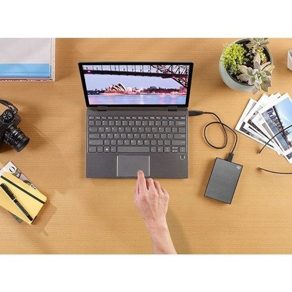 Space gray portable external hard drive, compact rectangular with cable