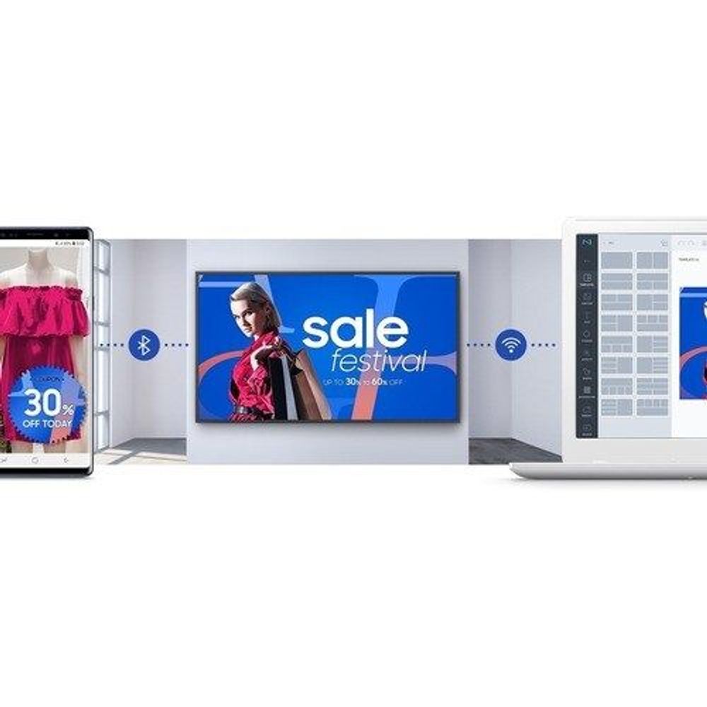 Digital signage display in a lobby with promotional graphics on screen