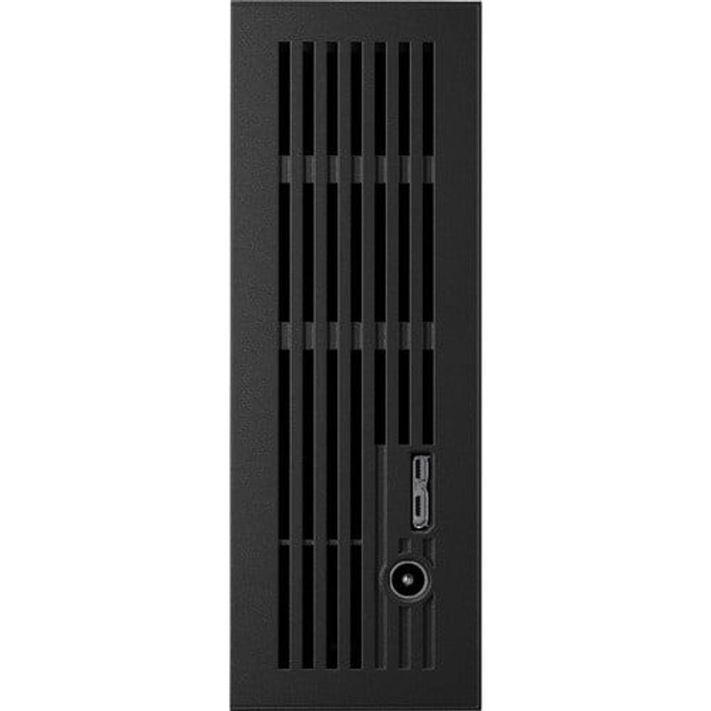 Black Seagate external hard drive side with cooling vents and USB ports