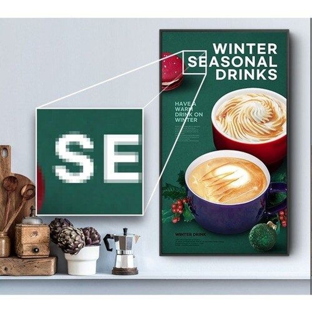 Wall-mounted LCD digital signage display showing winter drinks promotion and cup graphics