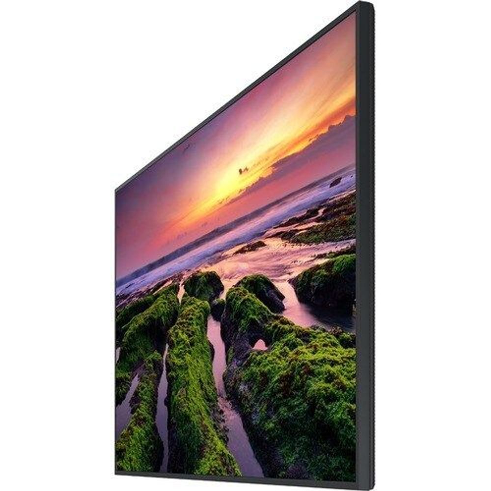 Angled view of Samsung QB50B 50-inch LCD digital signage display, showing landscape photo