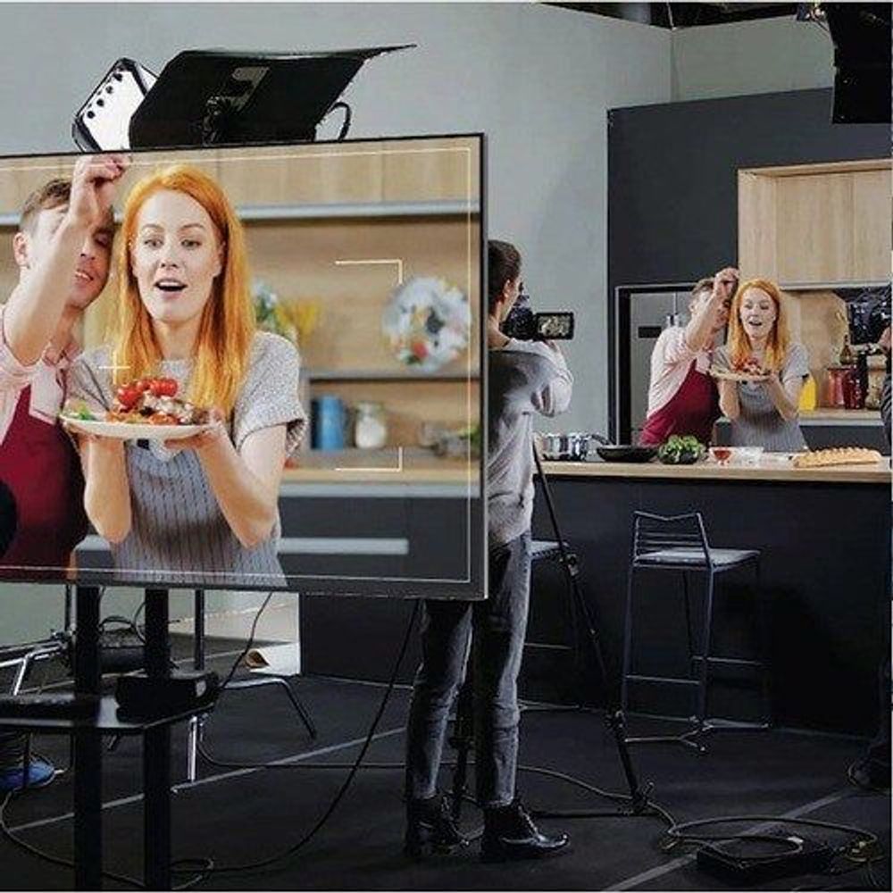 Samsung QB50B 50-inch LCD digital signage display, black bezel, showing video presentation