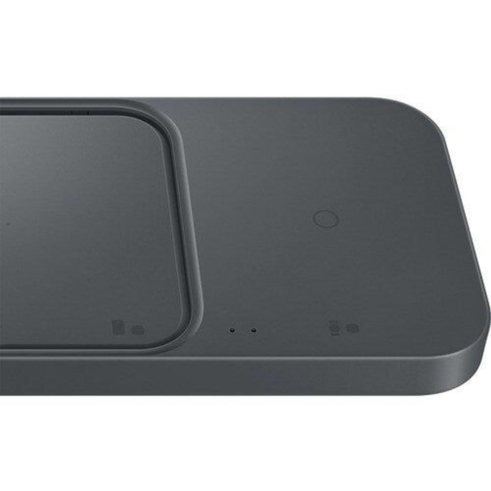 Close-up of dual charging pads on dark gray wireless charger dock base.