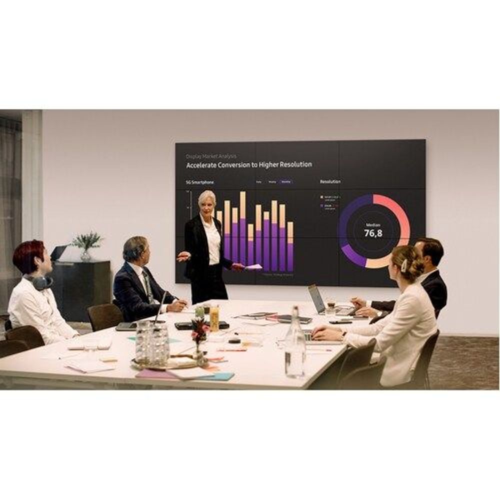 46-inch digital signage LCD display showing business charts in conference meeting