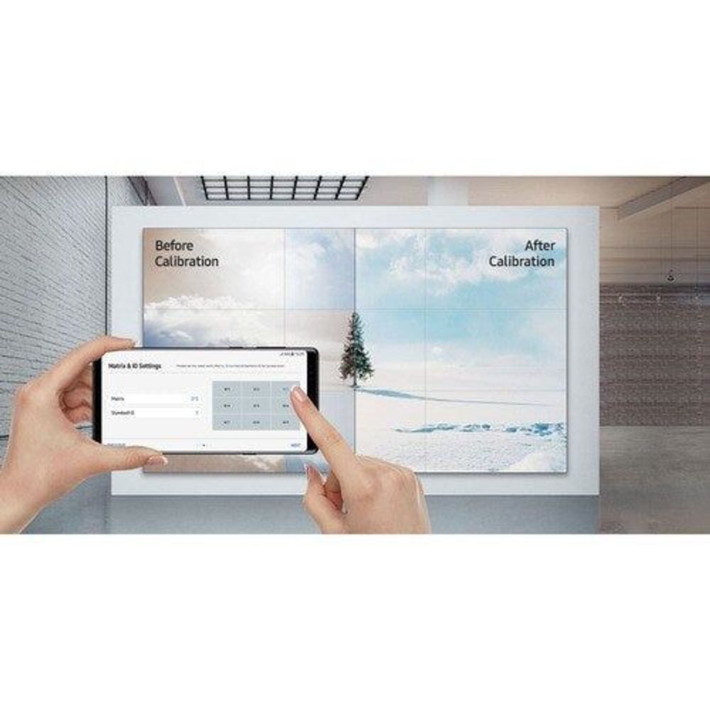 Samsung 55-inch digital signage LCD display with calibration screens, hands pointing