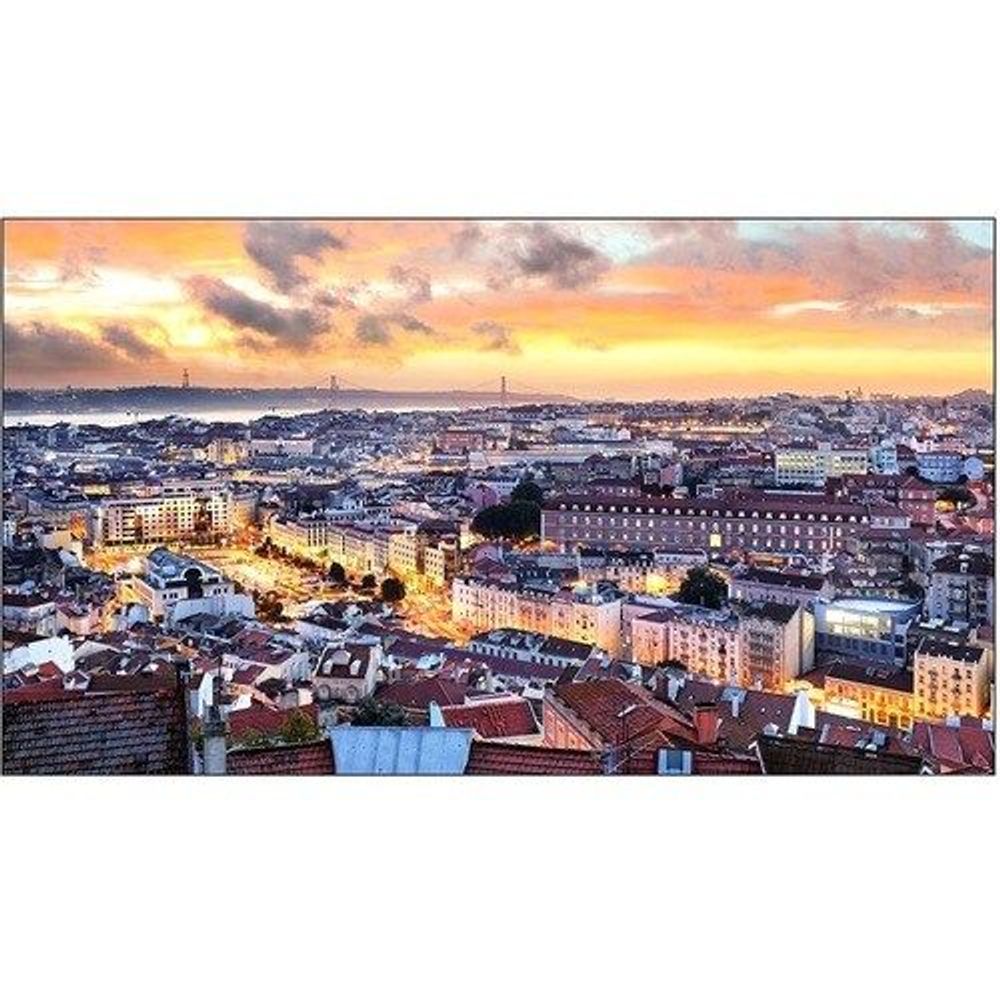 Samsung 55-inch digital signage LCD display showing an aerial cityscape at sunset