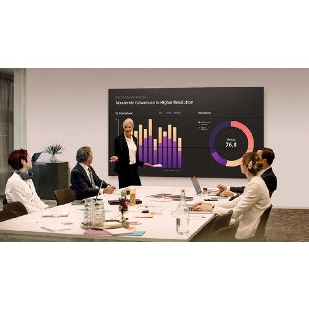 Samsung 55-inch digital signage LCD display showing a business presentation on-screen