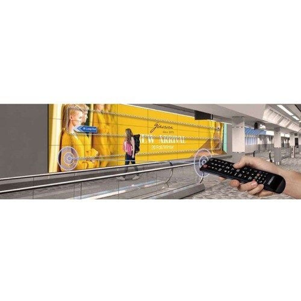 55-inch LCD digital signage display showing yellow banner scene with remote control