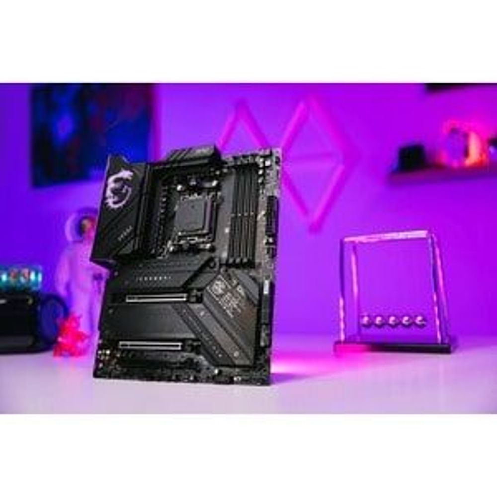 MSI MPG X670E gaming motherboard with black heatsinks and CPU socket installed
