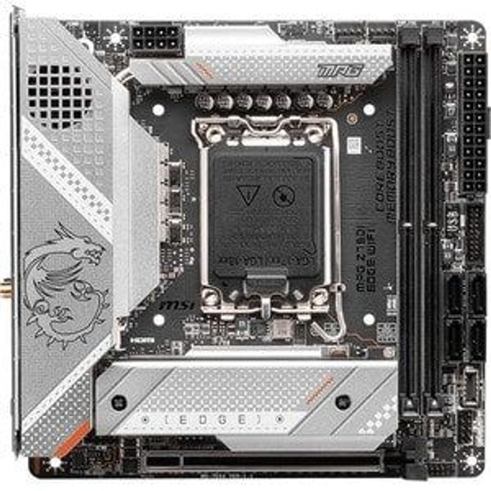 Gaming desktop motherboard close-up of CPU socket area on black PCB with silver cover