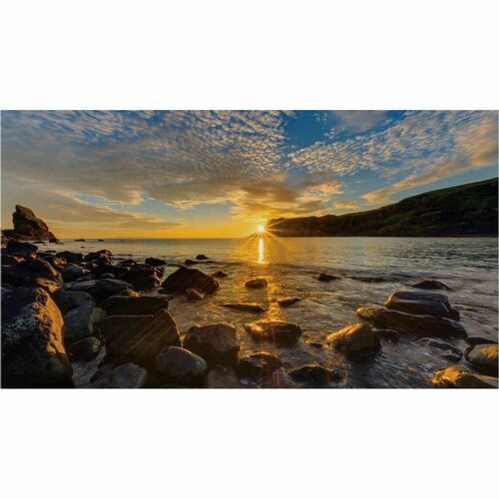 Digital signage LCD display showing ocean sunset landscape
