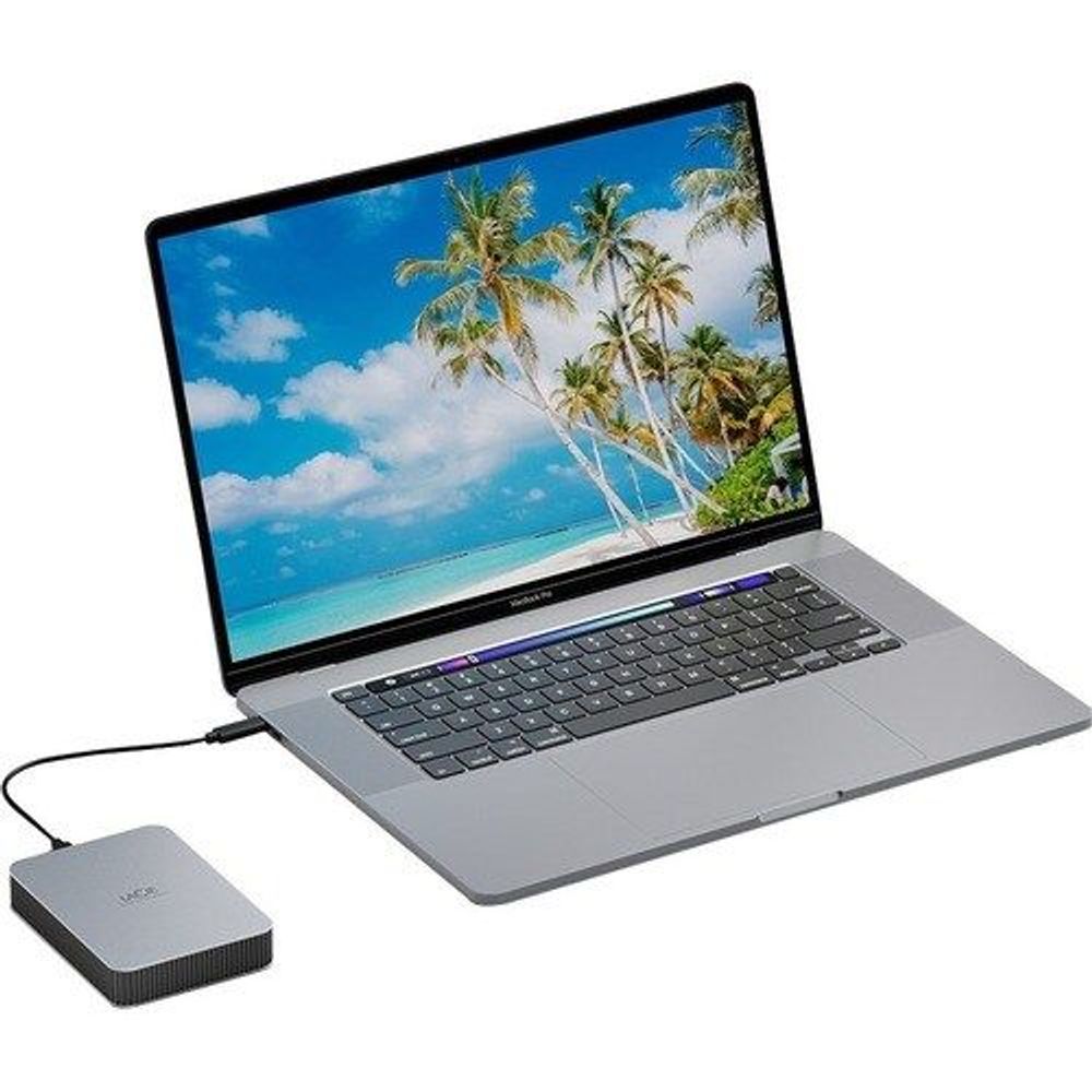 LaCie portable hard drive connected to laptop via USB cable