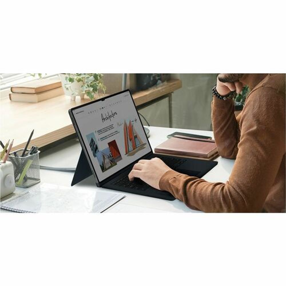 Black tablet keyboard cover case angled on a desk for viewing and typing