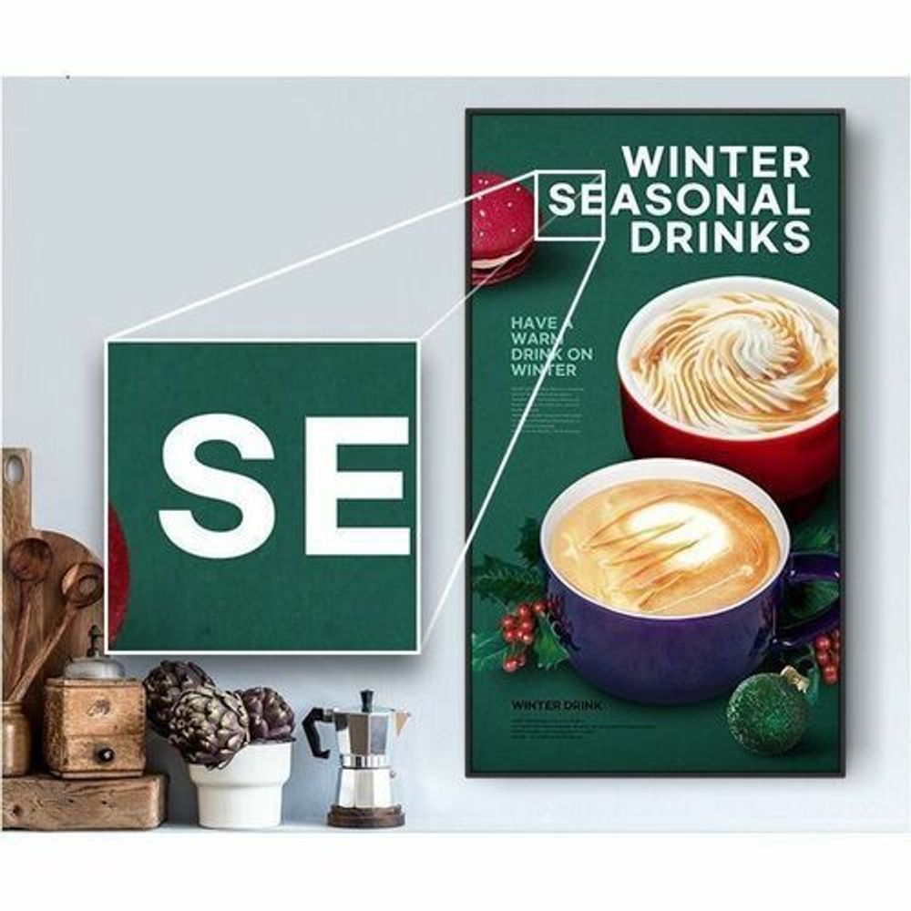 Digital signage LCD display with black bezel, showing winter drinks advertisement.