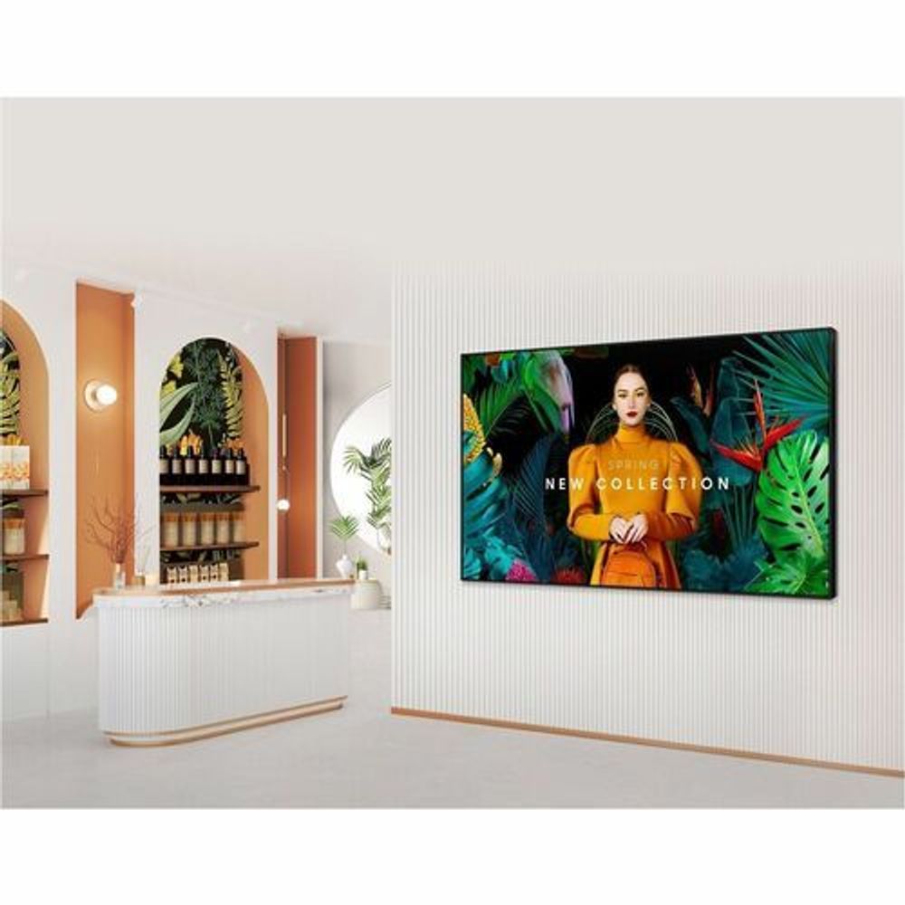 Wall-mounted Samsung digital signage display with landscape screen showing colorful content