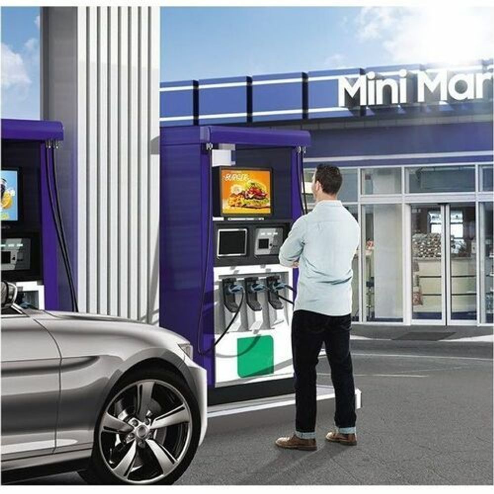 Outdoor LCD kiosk display with menu screen beside car and ordering station