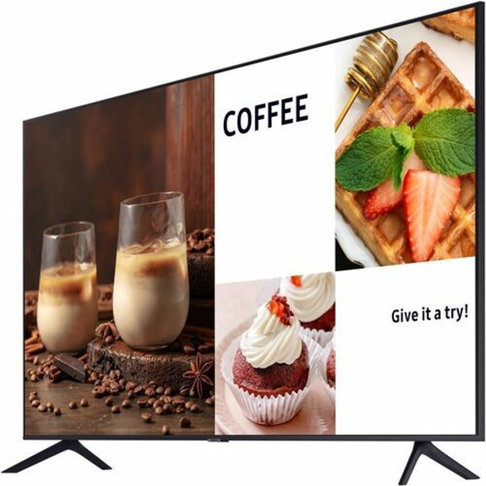 Samsung digital signage display showing coffee cups, cupcakes, and waffles with dark stand.